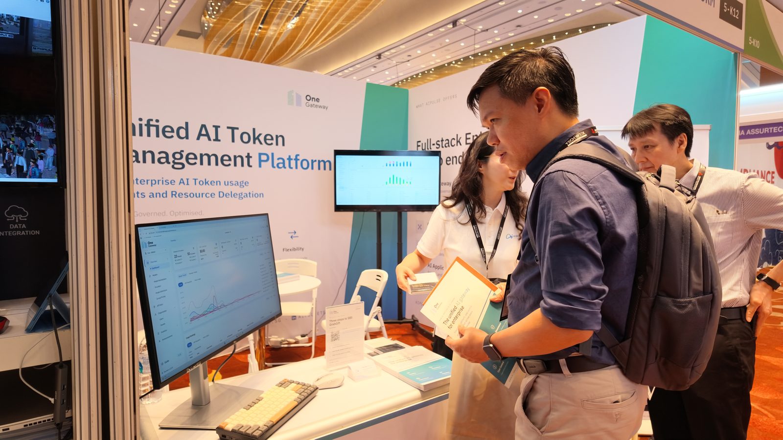 Visitors at the OneGateway demo station, Booth 5-K12, Tech Week Singapore 2026.