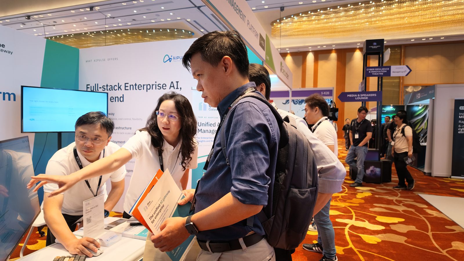 Conversations at the OneGateway demo station.