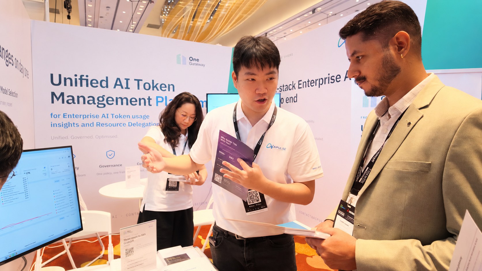 Walking a visitor through OneGateway at Booth 5-K12.